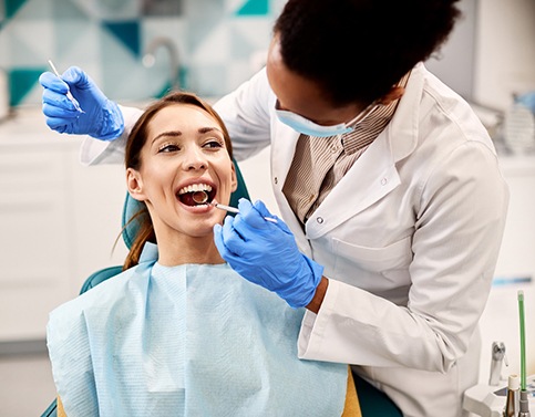 Patient undergoing treatment in the dentist’s chair