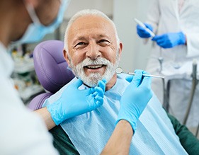 Man with dentures at the dentist